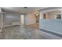 Inviting living room showcases sleek wood-look flooring and a neutral color palette at 11188 64Th Ter, Seminole, FL 33772