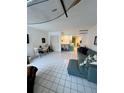 Open concept living space with surfboard ceiling decor and a combined dining and kitchen area at 16400 Gulf Blvd # 307, North Redington Beach, FL 33708