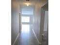 Inviting entryway featuring tile flooring and views of the living area with natural light at 2216 4Th Sw St, Ruskin, FL 33570