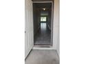 Inviting entryway featuring tile flooring and views of the living area with natural light at 2216 4Th Sw St, Ruskin, FL 33570
