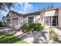 View of home with driveway, manicured lawn, and entrance at 35229 Janine Dr, Zephyrhills, FL 33541