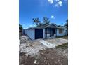 Exterior view of home with attached garage and front porch at 3950 45Th N Ave, St Petersburg, FL 33714