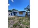 Home exterior with fenced in yard and covered porch at 3950 45Th N Ave, St Petersburg, FL 33714
