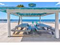 Inviting beachfront picnic area offering picnic tables, ocean views, and a relaxing atmosphere at 4408 Rudder Way, New Port Richey, FL 34652