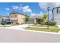 Beautiful exterior featuring a two-car garage, well-kept lawn with landscaping, and a welcoming entrance at 4507 Eternal Prince Dr, Sun City Center, FL 33573