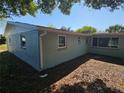 Backyard showcasing view of the home at 6731 Old Main St, New Port Richey, FL 34653