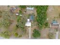 Overhead view of the home with an adjacent pool and surrounding foliage at 9615 Jasmine Blvd, New Port Richey, FL 34654