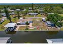 Aerial view featuring a waterfront property, boat dock, and a spacious backyard at 103 W North Branch Rd, Ruskin, FL 33570