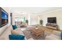 Spacious living room with plush furniture, stylish decor, and open floor plan for comfortable living and entertaining at 11250 108Th Ln, Largo, FL 33778