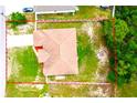 Aerial view outlining the property lines, showcasing the yard space with potential and proximity to treed areas at 13216 Antelope St, Spring Hill, FL 34609