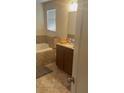 Bathroom features a soaking tub, granite vanity, and neutral-toned tile at 13752 Tensaw Dr, Hudson, FL 34669