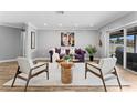 Stylish living room with hardwood floors, modern decor, statement art, and sliding doors to lanai at 2773 Seabreeze S Dr, Gulfport, FL 33707