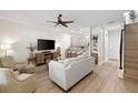 Bright living room with a ceiling fan, light wood floors, and open concept floor plan at 3702 W Cass St # 5, Tampa, FL 33609