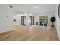Open-concept living area featuring wood flooring, abundant natural light, and modern finishes at 3923 Shoreside Cir, Tampa, FL 33624