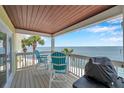 Relaxing balcony features seating and views of the ocean, perfect for enjoying the scenery at 5260 Coquina Key Se Dr # C, St Petersburg, FL 33705