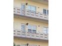 Close-up of condo balconies with aluminum railings and decorative accents, showcasing outdoor living spaces at 5705 80Th N St # 303, St Petersburg, FL 33709