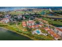 Community featuring a pool, clubhouse and access to a golf course at 6158 Palma Del Mar S Blvd # 306, St Petersburg, FL 33715
