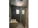 Modern bathroom with glass door shower, vanity, and tiled floors at 807 E Elm St, Tampa, FL 33604