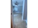 Bedroom with neutral paint, window, ceiling fan, and tile floors at 807 E Elm St, Tampa, FL 33604
