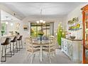 Bright dining area with a round table, stylish chairs, and views of the outdoor space, perfect for entertaining at 9209 Seminole Blvd # 156, Seminole, FL 33772