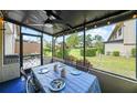 Relaxing screened-in patio overlooking a landscaped yard at 9209 Seminole Blvd # 156, Seminole, FL 33772