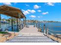 Private boat dock with seating, offering direct water access and serene views at 106 Midway Is, Clearwater Beach, FL 33767
