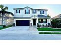 Charming two-story home with a well-maintained lawn, two car garage and a beautiful entrance at 1147 Halapa Way, Trinity, FL 34655