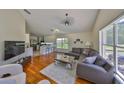 Bright living room with hardwood floors, modern furniture, and natural light at 14502 Pond Cypress Way, Tampa, FL 33626