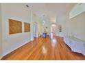 Open concept living area with hardwood floors, dining space, and bright lighting at 14502 Pond Cypress Way, Tampa, FL 33626