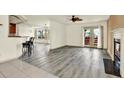 Inviting living room with hardwood floors, fireplace, and natural light at 14561 El Paseo Dr, Seminole, FL 33776