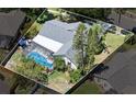 Overhead view of home featuring private pool, landscaped backyard, and mature trees at 1914 Elk Spring Dr, Brandon, FL 33511