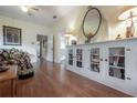 Open living area with hardwood floors, built-in cabinets, and views into adjoining rooms at 204 E North St, Tampa, FL 33604