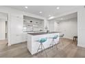 Modern kitchen with a large island, seating, stainless steel appliances, and sleek white cabinets at 205 5Th N Ave # 501, St Petersburg, FL 33701