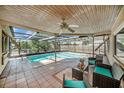 Inviting screened-in pool area perfect for relaxation and outdoor entertainment with a covered ceiling at 2632 Tung Dr, Holiday, FL 34691