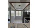 Well-lit kitchen features tile floors, a view from the window, and appliances at 2753 Countryside Blvd # 107, Clearwater, FL 33761