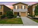 Charming townhome with a one car garage, manicured landscaping, and neutral color palette at 4528 Winding River Way, Land O Lakes, FL 34639
