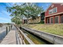 Picturesque waterfront condos with a wooden boardwalk along the tranquil canal at 5582 Baywater Dr, Tampa, FL 33615