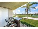 Charming balcony with outdoor seating and scenic views of the adjacent golf course and lush greenery at 6151 Bahia Del Mar Blvd # 126, St Petersburg, FL 33715