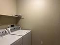 Functional laundry area equipped with a modern washer and dryer at 9481 Highland Oak Dr # 814, Tampa, FL 33647
