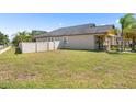 Spacious backyard with a well-maintained lawn and a privacy fence at 9931 Victory Gallop Loop, Ruskin, FL 33573
