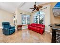 Bright living room with vaulted ceilings, tiled floors, large windows, and comfortable seating at 10764 70Th Ave # 5302, Seminole, FL 33772