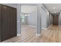 Inviting entryway with new flooring, and an interior view to a dining room at 11006 Tahiti Isle Ln, Tampa, FL 33647