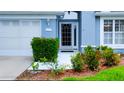 Close up of the front door to a beautiful home with a decorative glass insert at 14116 Whitecap Ave, Hudson, FL 34667