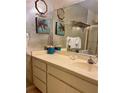 This bathroom offers a vanity and shower-tub combination at 16330 Gulf Blvd # 201, Redington Beach, FL 33708