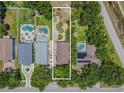 Aerial view outlines the property's boundaries and location relative to neighboring homes and landscaping at 316 Lafayette Blvd, Oldsmar, FL 34677