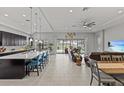 Open concept living space with large kitchen island and seamless access to the outdoor patio area at 1002 Cavour Ct, Brandon, FL 33511