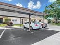 Assigned covered parking for the townhouses, offering protection from the elements at 1041 Bowsprit Ln # 1041, Holiday, FL 34691