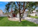 Inviting home with a neat lawn, mature trees, and a convenient two-car garage at 10739 Shady Preserve Dr, Riverview, FL 33579
