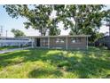 Charming single-story home with a covered carport and classic curb appeal at 2004 Windsor Way, Tampa, FL 33619