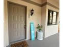 Charming front door with decorative accents and a welcoming entrance at 3044 Red Oak Ct # 204, Palm Harbor, FL 34684
